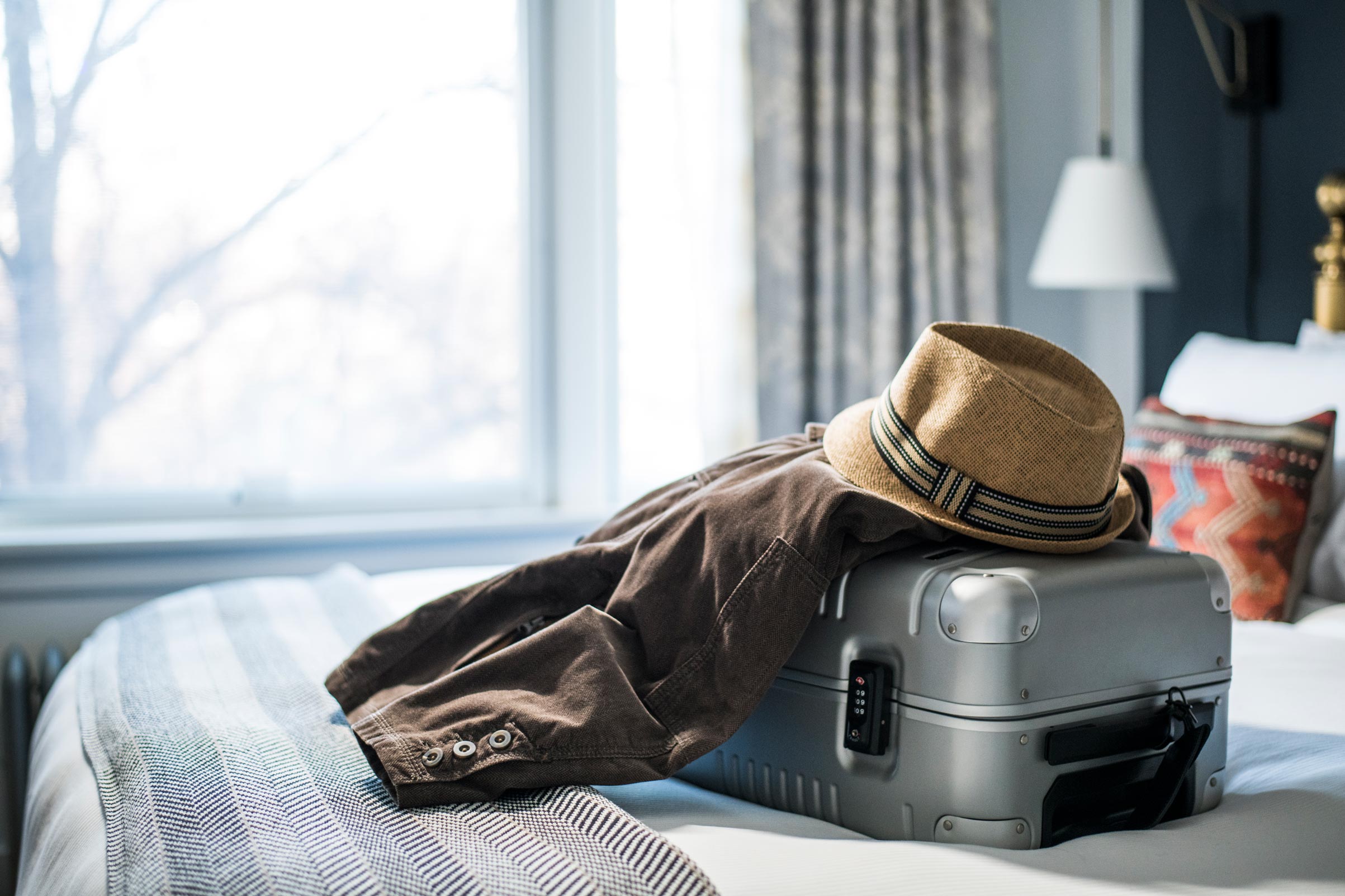 Bag, Hat and Coat on a Bed