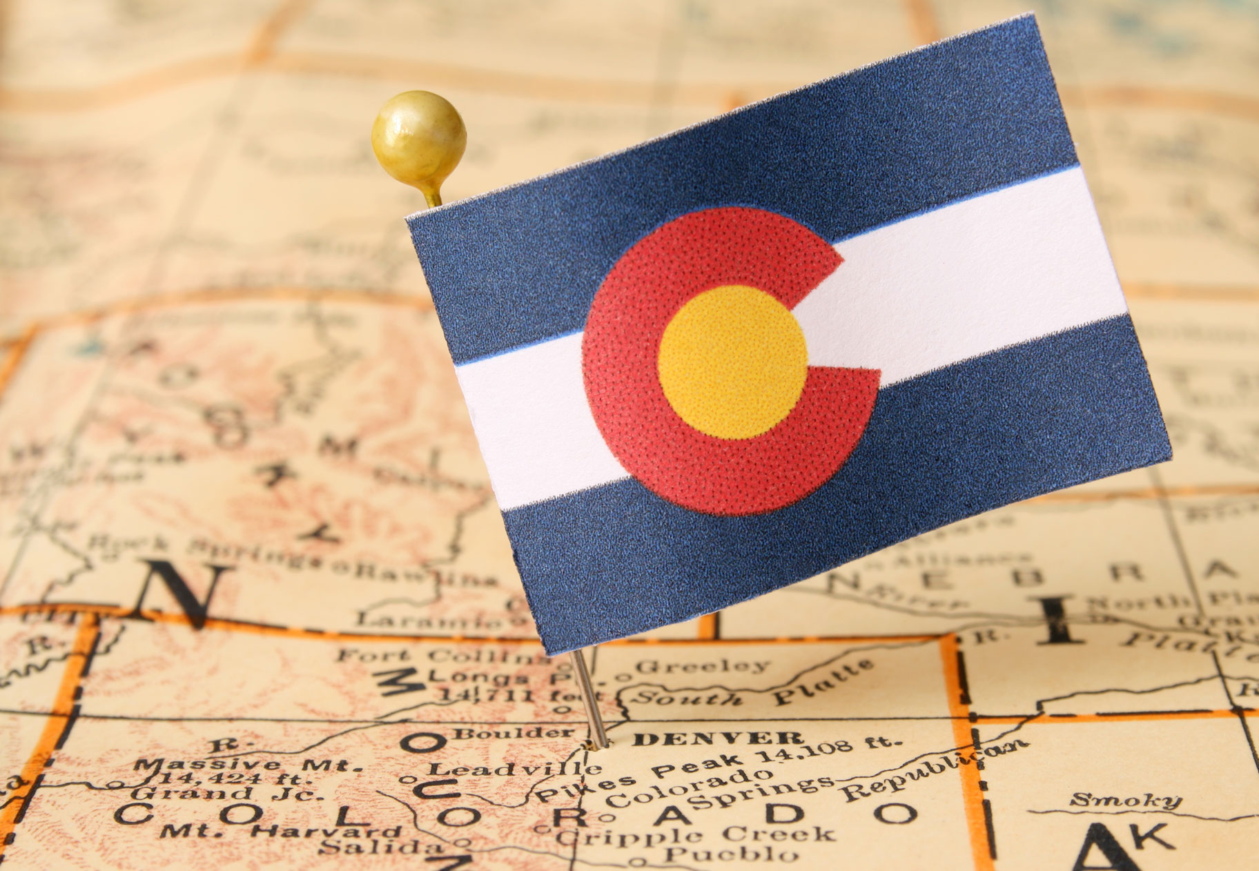 Colorado Flag Pinned to Map of Colorado