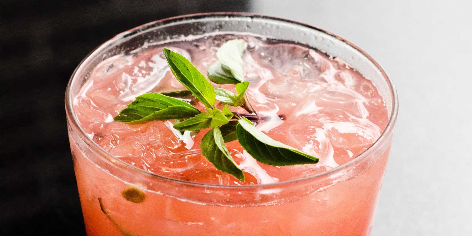 Pink cocktail with mint leaves